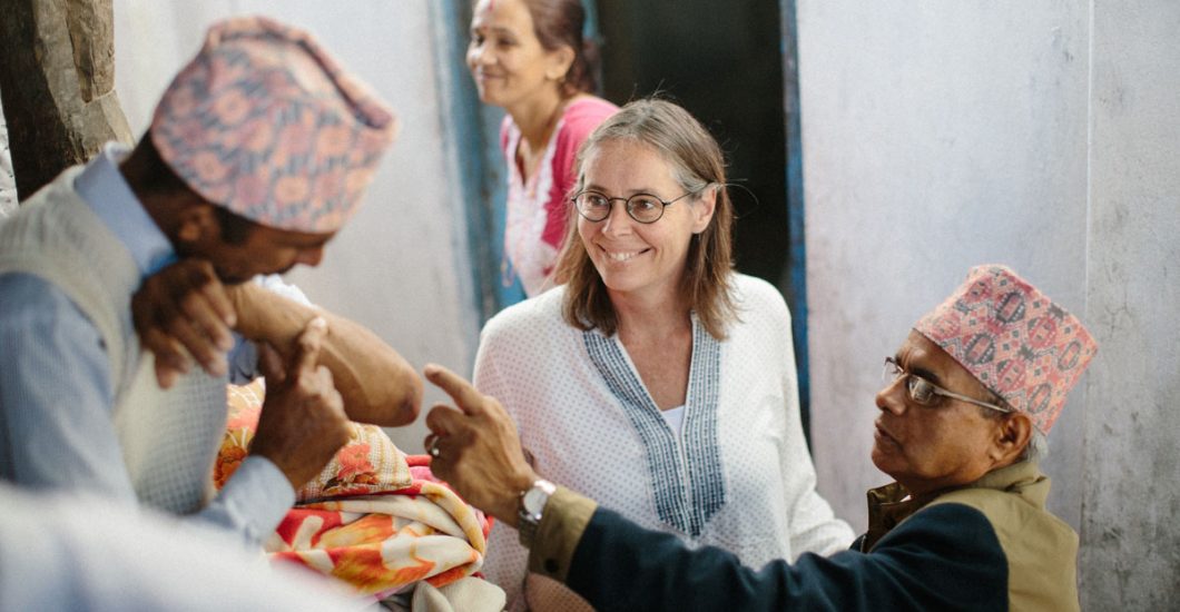 Liesbeth Miedras and leprosy doctor from NLR checking a person affected by leprosy in Nepal